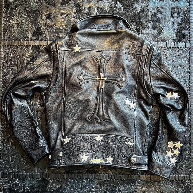 Chrome Hearts silver ring and leather jacket detail